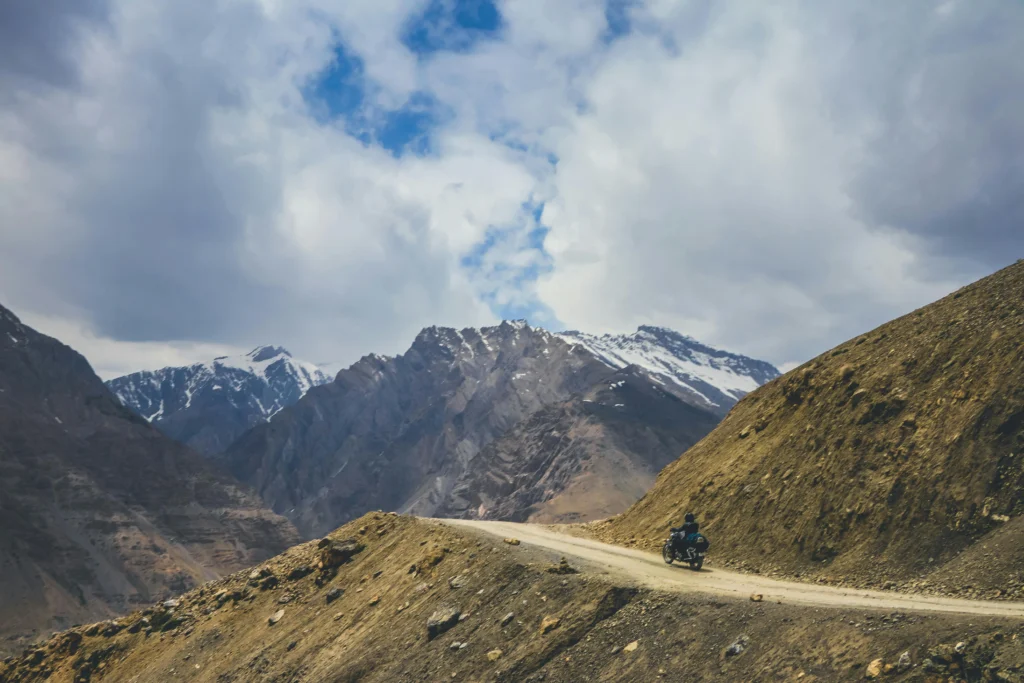 Bike rider exploring Komic Village, one of the highest motorable villages in the world, Spiti Valley